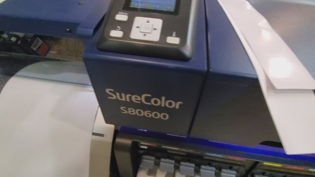 Video of custom perforated window film being printed on Epson SureColor S80600 wide-format printer.